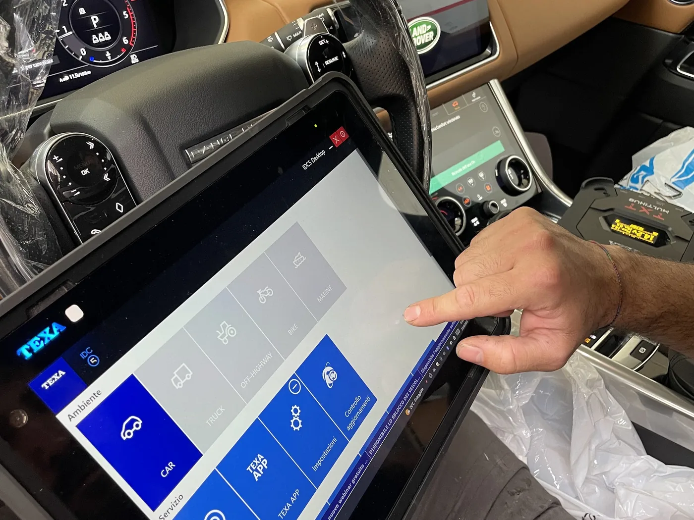 ADAS calibration in the workshop with an OBD diagnostic tool and tablet