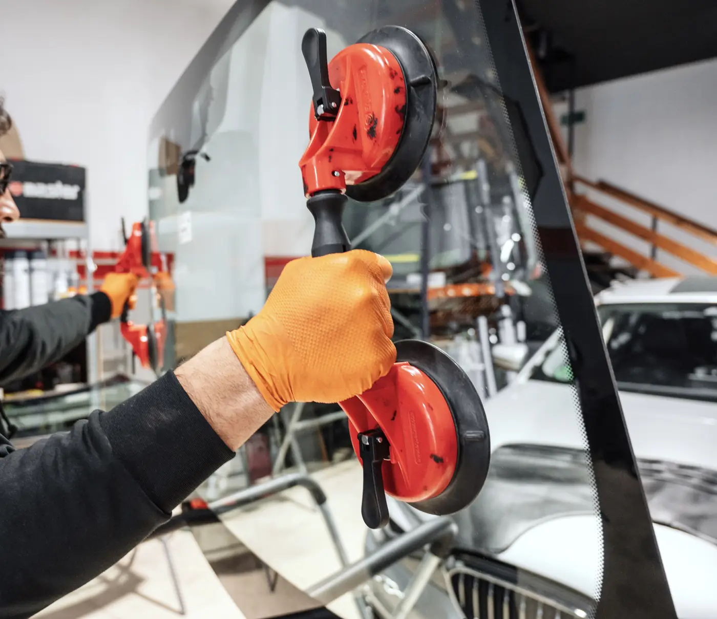 Windscreen replacement with professional suction cups in the Nova Umbra Glass workshop